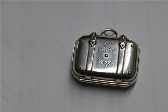 A Victorian silver vinaigrette modelled as a travelling suitcase, inscribed Katie 1877